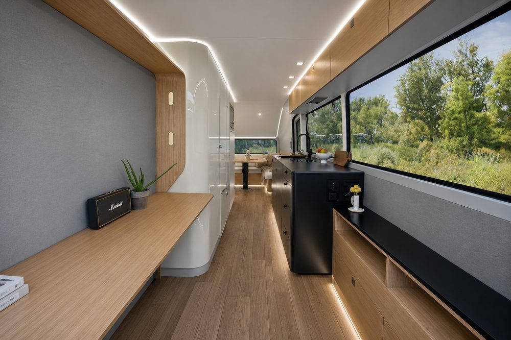 Light oak and white Pebble Flow interior concept with galley kitchen, desk and panoramic window